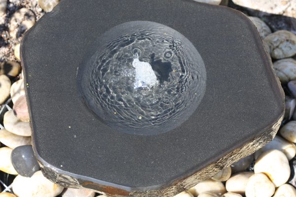 Babbling basalt fountain with plinth