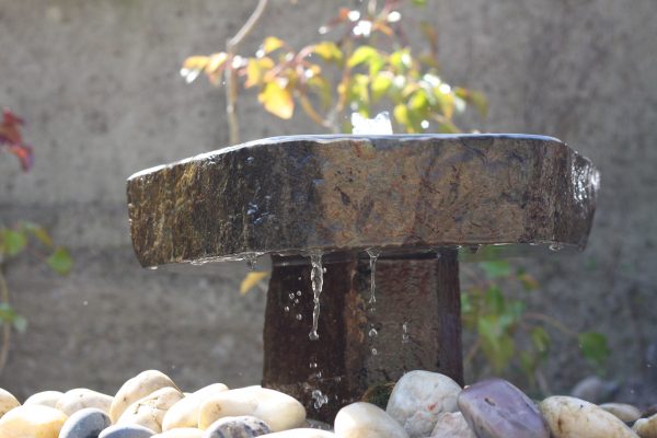 Babbling basalt fountain with plinth